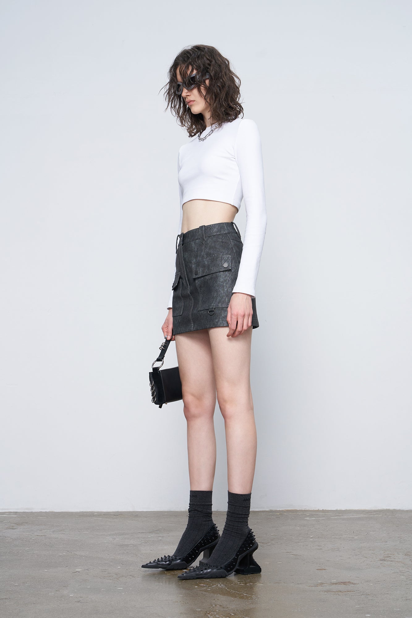 Irregular pocket leather skirt