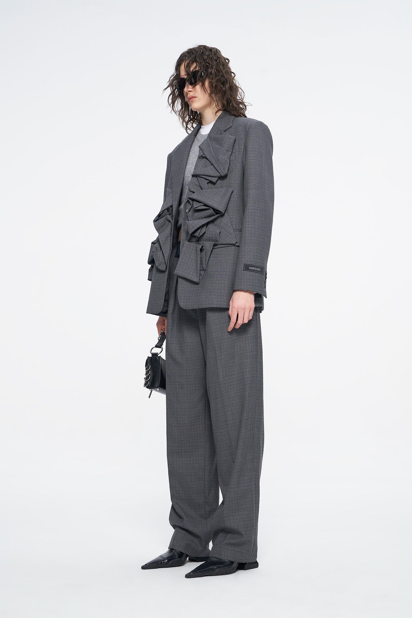 Wool suit with irregular shape