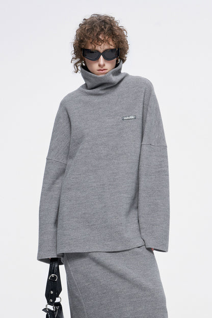 high-necked sweater with a loose silhouette