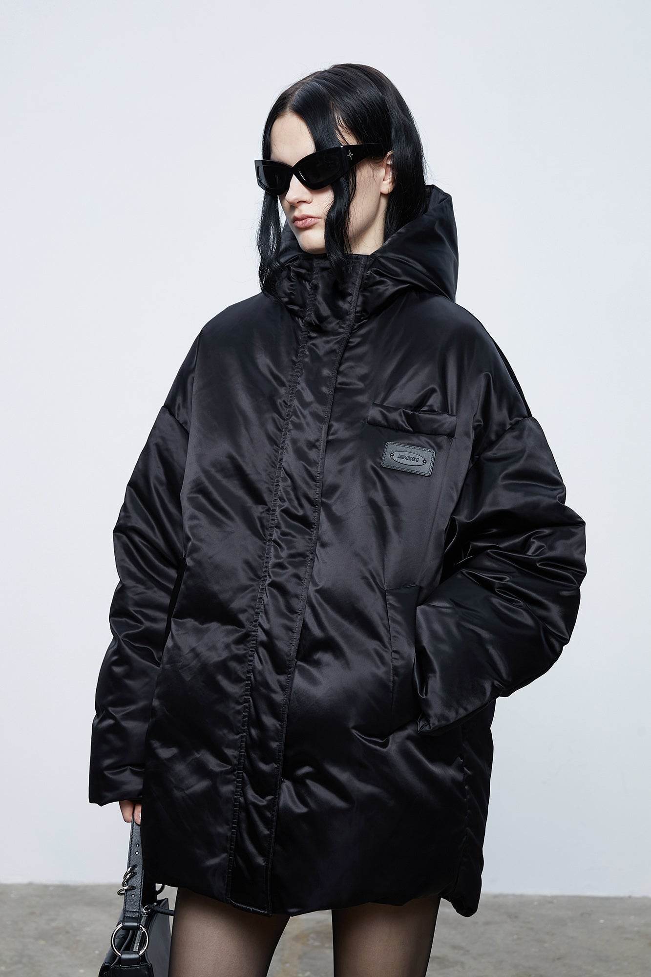 Loose hooded puffer jacket with inner quilting